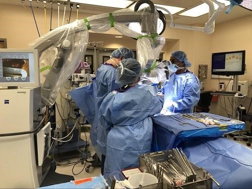 Operating room image of the endoscopic/microscopic lumbar discectomy. Operating room image of the endoscopic/microscopic lumbar discectomy.